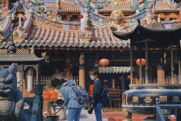 students exploring Korean traditions while studying language in traditional house setting, realistic high quality photo