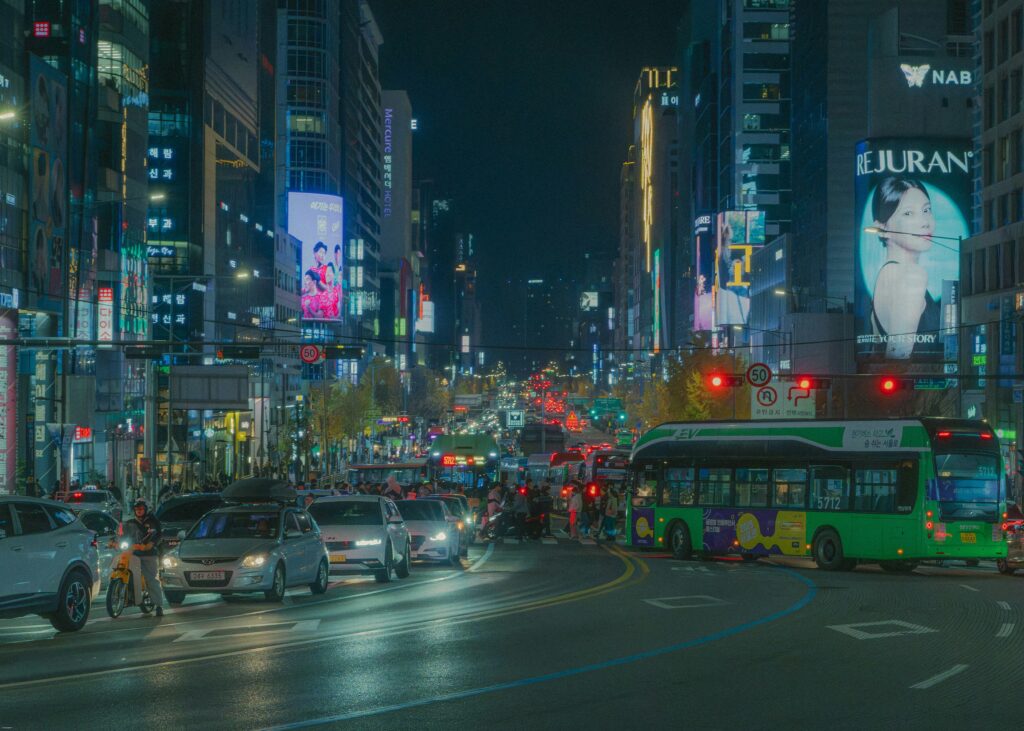 friends talking happily in Korean on Seoul street, natural everyday moment, realistic high quality photo