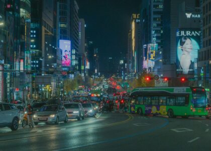 friends talking happily in Korean on Seoul street, natural everyday moment, realistic high quality photo